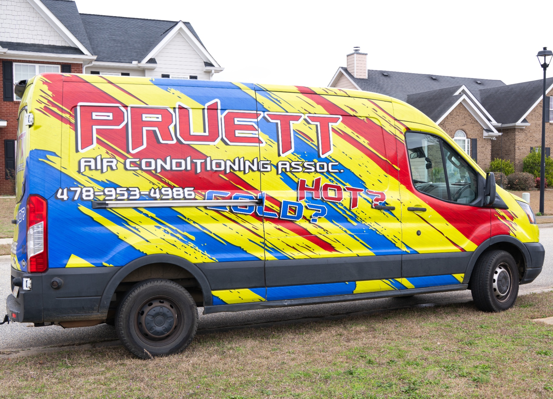 Pruett Air Conditioning service van in a Warner Robins, GA neighborhood